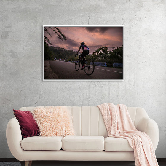 "Male bicycling along a treed road in Ooty"