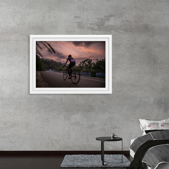 "Male bicycling along a treed road in Ooty"