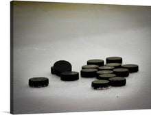  “Pile of Hockey Pucks” is a captivating artwork that brings the raw energy and spirit of the game into your space. Each puck, frozen and scarred from battle, tells a story of fierce competition and unyielding determination. This print is more than a photograph; it’s a piece of history, an intimate look into the soul of hockey. Every scratch, every mark, every icy touch is preserved in stunning detail to ignite the passion and fire synonymous with this beloved sport.