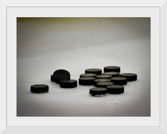 "Pile of Hockey Pucks"