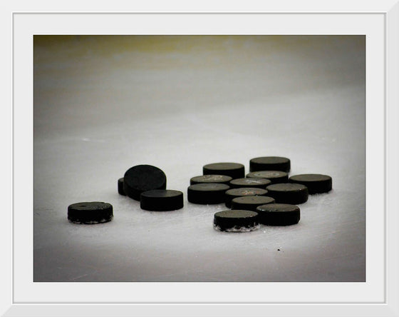 "Pile of Hockey Pucks"