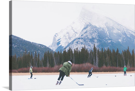 Immerse yourself in the exhilarating sight of hockey players gracefully gliding across a frozen lake nestled amidst majestic mountains in Banff National Park. The vibrant energy and skillful movements of the players create a captivating scene that captures the essence of winter sports. 