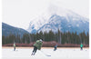 "Children Playing Ice Hockey in Banff National Park"