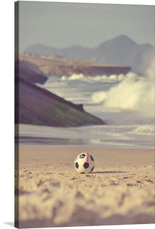  “Soccer on the Beach”: Capture the essence of the beautiful game against a backdrop of sun-kissed sands and gentle waves. In this exquisite print, a pristine soccer ball rests, awaiting the next kick, while the ocean’s rhythmic embrace provides a soothing symphony. The contrast between the precision of the ball and the organic contours of the beach creates a harmonious visual narrative.