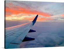  “Experience the beauty of the sky from the comfort of your own home with this stunning print of a sunset view from an airplane window. The vibrant colors and unique perspective make this a must-have for any art lover.” The image is a photo-realistic view of a sunset over the ocean, taken from the perspective of an airplane window. 