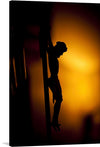 This stark silhouette of Jesus on the cross is a powerful and moving image. The stark contrast between the dark figure and the bright background creates a dramatic tension, while the simplicity of the lines emphasizes the solemnity of the scene. The viewer's eye is drawn to Jesus' outstretched arms, a symbol of both sacrifice and compassion.