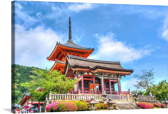 Immerse yourself in the serene beauty of Asia with this exquisite print of a Buddhist Temple nestled amidst nature’s embrace. Every detail, from the intricate architectural designs adorned with rich, vibrant colors to the lush greenery and blooming flowers that surround it, is captured with stunning clarity. The sky above paints a picturesque backdrop, where clouds gently kiss the towering pagoda that stands as a testament to ancient artistry and spiritual sanctity. 