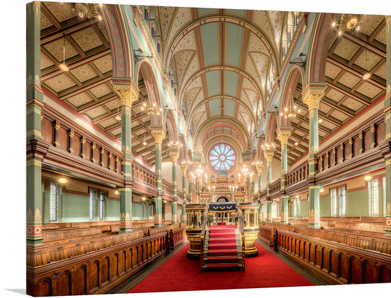 “Princes Road Synagogue Nave” is a captivating print that brings the architectural grandeur and spiritual serenity of this iconic space into your home.  Located in Liverpool, Mersyside, England, UK, every detail, from the intricate designs adorning the majestic columns to the ethereal glow illuminating the sacred hall, is captured with exquisite clarity. 