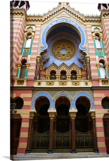  “Synagogue de Prague” is a captivating stained glass artwork that weaves together rich history and artistic mastery. The image showcases an intricately designed facade of this architectural gem, located in the ancient Jewish quarter of Josefov, Prague. The synagogue, built in 1270, is still being used as a house of prayer and stands as the oldest surviving synagogue in Europe. Its cavernous spaces, ornate decorations, and Gothic architecture evoke a sense of reverence and wonder. 