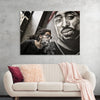 "Man With Dreadlocks and Sunglasses Poses Near Tupac Shakur Portrait"