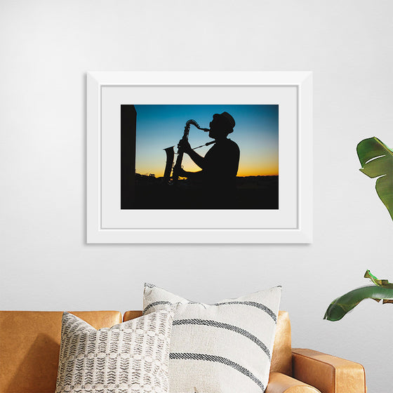 "Silhouette of a Man Playing Saxophone during Sunset", Victor Freitas