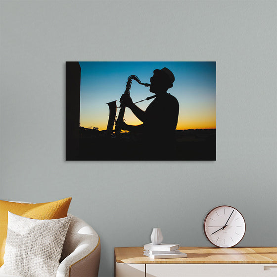 "Silhouette of a Man Playing Saxophone during Sunset", Victor Freitas