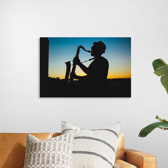 "Silhouette of a Man Playing Saxophone during Sunset", Victor Freitas