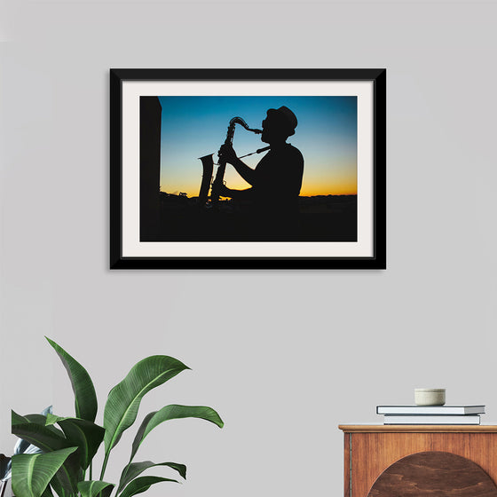 "Silhouette of a Man Playing Saxophone during Sunset", Victor Freitas