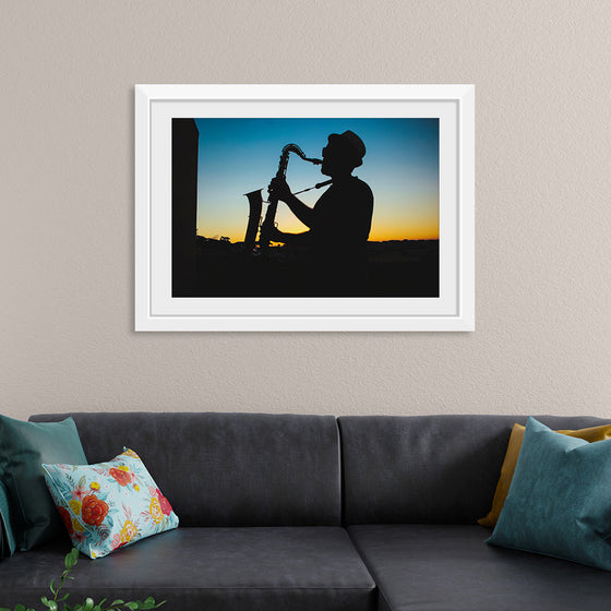 "Silhouette of a Man Playing Saxophone during Sunset", Victor Freitas