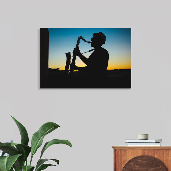 "Silhouette of a Man Playing Saxophone during Sunset", Victor Freitas