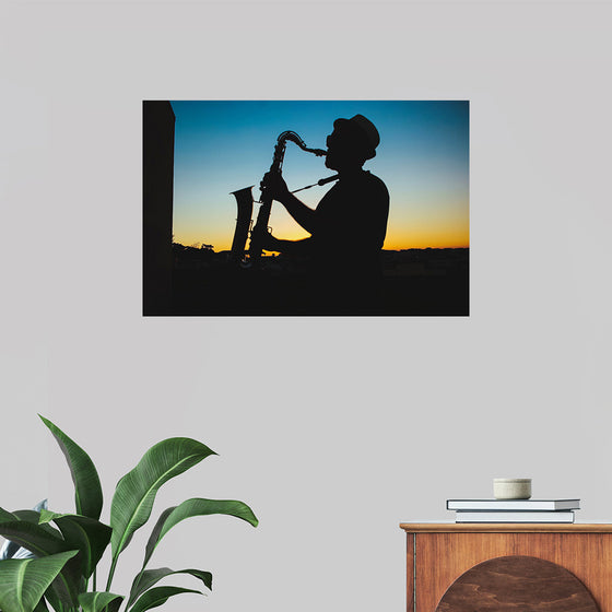 "Silhouette of a Man Playing Saxophone during Sunset", Victor Freitas