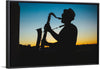 "Silhouette of a Man Playing Saxophone during Sunset", Victor Freitas