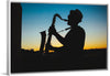 "Silhouette of a Man Playing Saxophone during Sunset", Victor Freitas