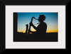 "Silhouette of a Man Playing Saxophone during Sunset", Victor Freitas