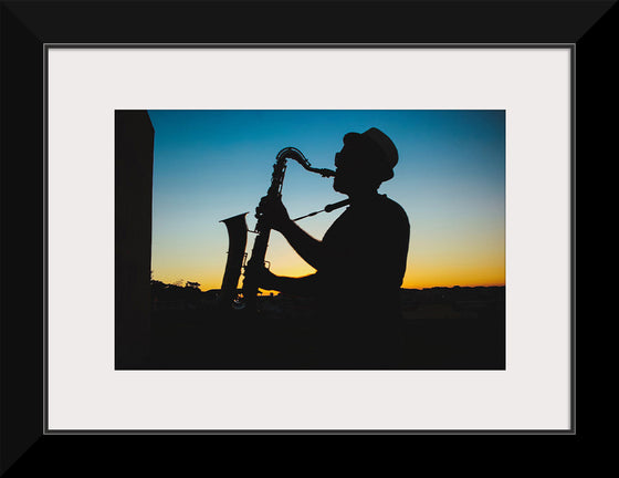 "Silhouette of a Man Playing Saxophone during Sunset", Victor Freitas