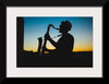 "Silhouette of a Man Playing Saxophone during Sunset", Victor Freitas