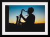 "Silhouette of a Man Playing Saxophone during Sunset", Victor Freitas