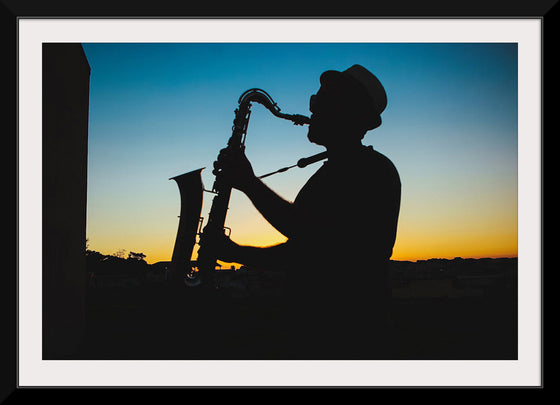 "Silhouette of a Man Playing Saxophone during Sunset", Victor Freitas