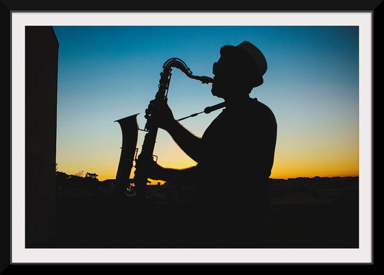 "Silhouette of a Man Playing Saxophone during Sunset", Victor Freitas