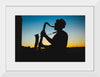 "Silhouette of a Man Playing Saxophone during Sunset", Victor Freitas