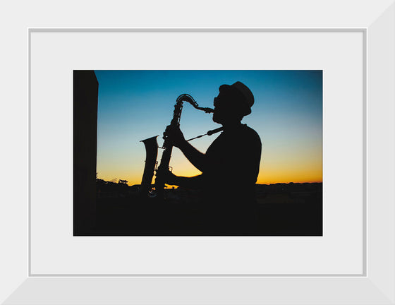 "Silhouette of a Man Playing Saxophone during Sunset", Victor Freitas