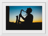 "Silhouette of a Man Playing Saxophone during Sunset", Victor Freitas