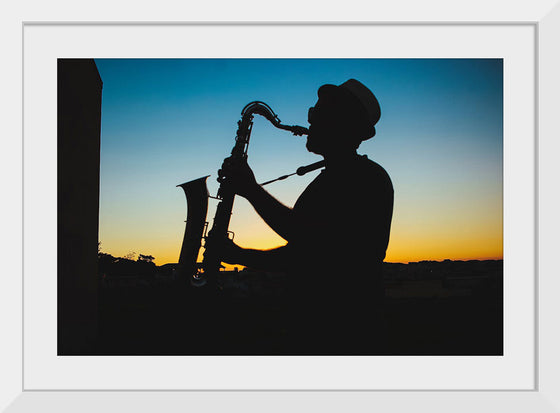 "Silhouette of a Man Playing Saxophone during Sunset", Victor Freitas