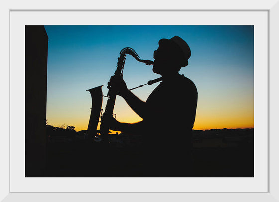 "Silhouette of a Man Playing Saxophone during Sunset", Victor Freitas