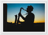 "Silhouette of a Man Playing Saxophone during Sunset", Victor Freitas