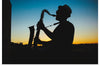 "Silhouette of a Man Playing Saxophone during Sunset", Victor Freitas