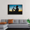 "Silhouette of a Man Playing Saxophone during Sunset", Victor Freitas