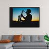 "Silhouette of a Man Playing Saxophone during Sunset", Victor Freitas