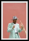 "Man in Teal Suit Holding Trumpet"