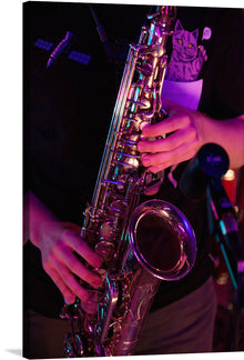  Immerse yourself in the soul-stirring echoes of jazz with this exquisite print capturing a musician’s intimate moment with their saxophone. Every curve, every gleam of the instrument is rendered in stunning detail, set against a backdrop bathed in enigmatic lighting. The cat emblem on the player’s attire adds an element of mystique, making this artwork a conversation starter.