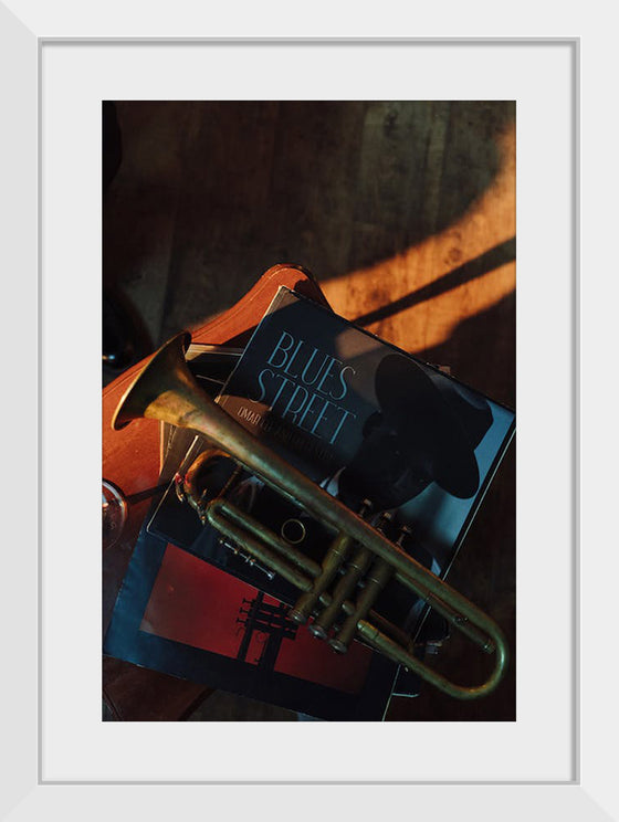 "Trumpet on Top of Stacked Vinyl Records"