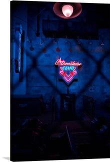  This stunning artwork of a neon sign in a dark room is a must-have for any fan of neon art or vintage aesthetics. The sign is a bright and cheerful red, and it casts a warm glow over the dark room. The sign is also notable for its typography, which is bold and eye-catching.