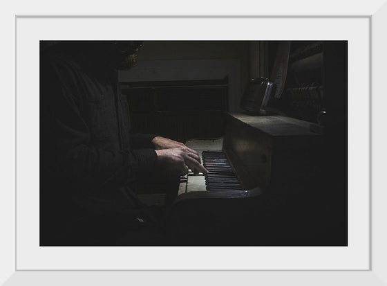 "Man Playing an Old Piano"