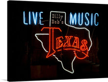  Illuminate your space with the vibrant energy of live music encapsulated in this stunning print of the iconic “Billy Bob’s Texas” neon sign. Every curve and color, from the electric blue letters spelling out “LIVE MUSIC” to the radiant red and white outline of Texas, is captured with exquisite detail. This artwork isn’t just a piece of decoration; it’s a slice of Texan nightlife, a symbol of the soul-stirring experience that only live music can offer.