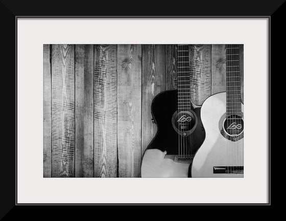 "Two Grayscale Acoustic Guitars"