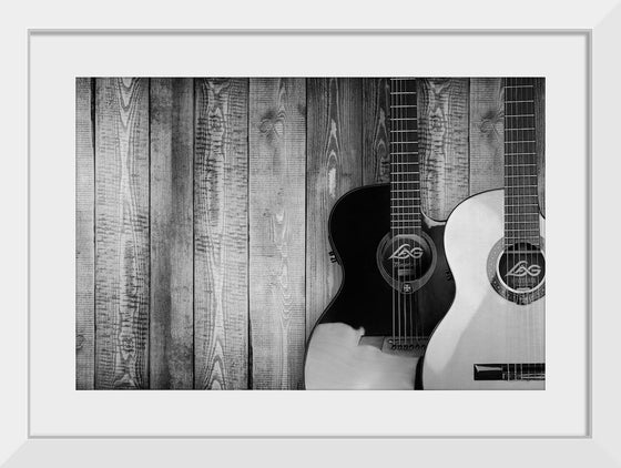 "Two Grayscale Acoustic Guitars"