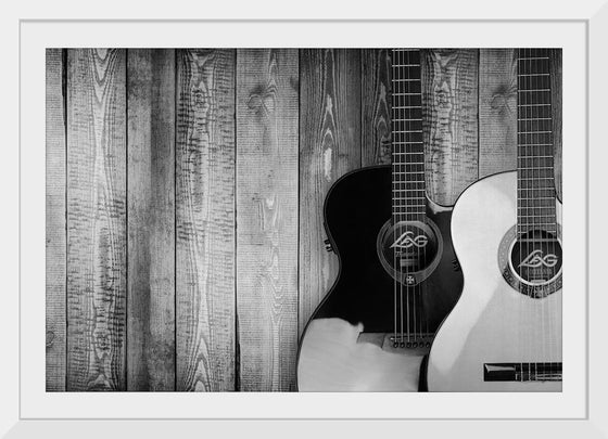 "Two Grayscale Acoustic Guitars"