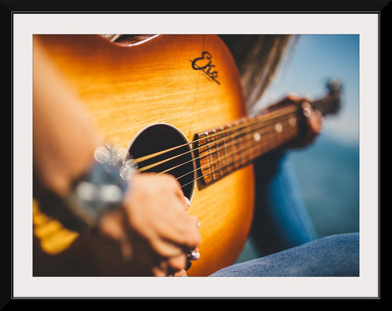 "Person Play Guitar in Close-up Photo"