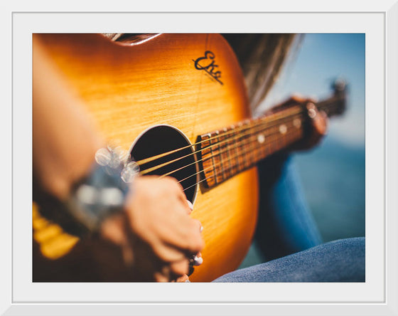 "Person Play Guitar in Close-up Photo"