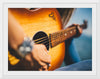 "Person Play Guitar in Close-up Photo"